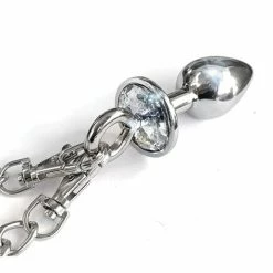 Global Novelties LLC Kink & BDSM Nixie Metal Butt Plug W-inlaid Jewel & Cuff Set - Silver Metallic